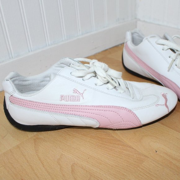 white pumas with pink